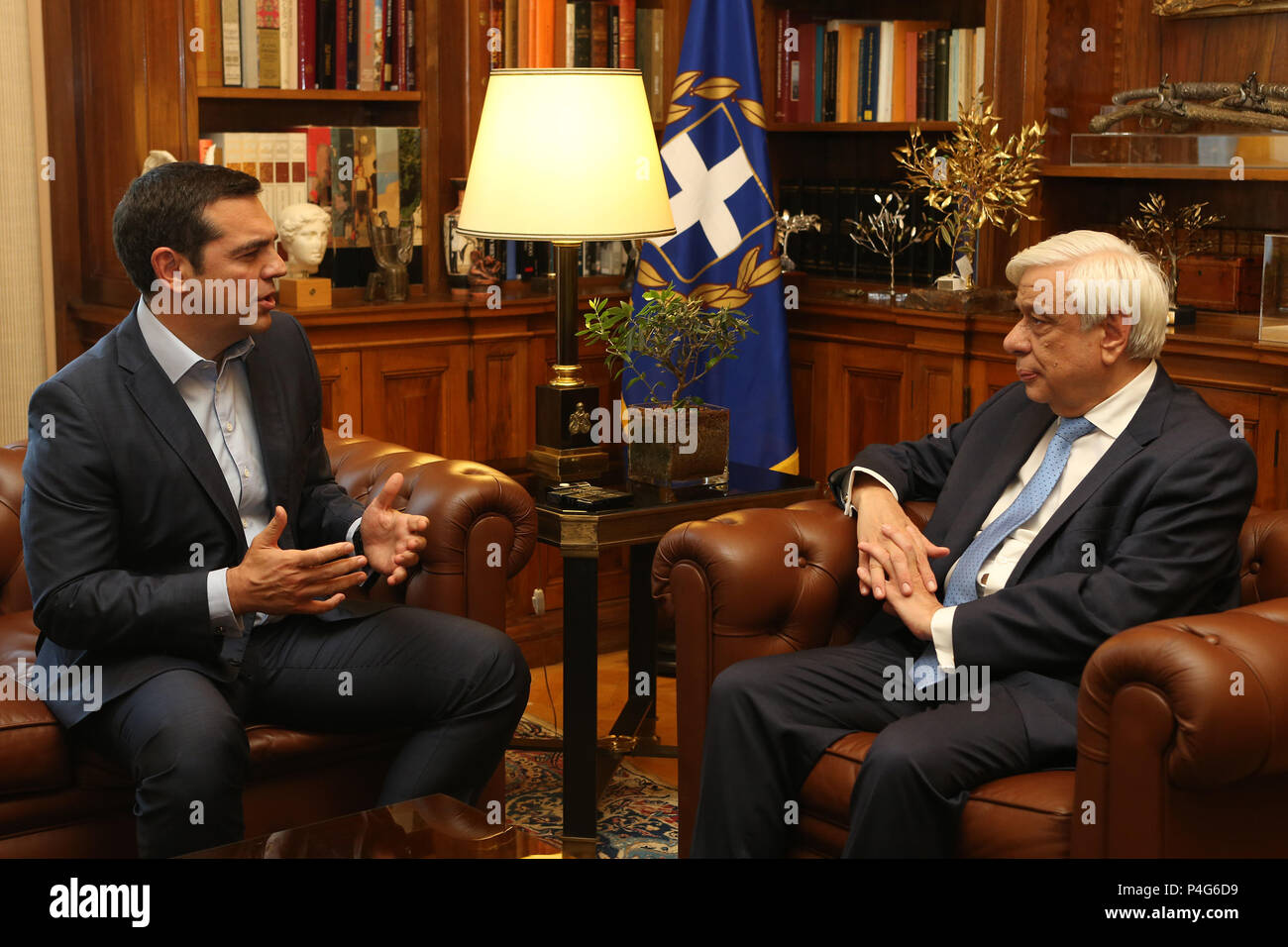Athens, Greece. 22nd June, 2018. Greek President Prokopis Pavlopoulos (R) speaks with the Greek Prime Minister Alexis Tsipras during their meeting at the Presidential office, in Athens, Greece, on June 22, 2018. Greece's political leadership warmly welcomed on Friday Eurogroup's 'historic decision' on the Greek debt, which opens the way for the exit from the bailouts era this summer after eight years of debt crisis. Credit: Marios Lolos/Xinhua/Alamy Live News Stock Photo
