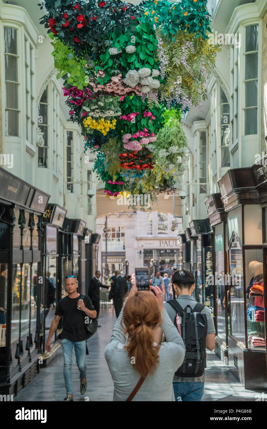 London, UK. 22nd June 2018. 2000 bespoke paper flowers by artist Mathilde Nivent creating a 'Hanging Garden of Flowers' in the Burlington Arcade in Mayfair -  this is part of Mayfair Art Weekend and coincides with the Royal Academy celebrating its 250th anniversary. Credit: Guy Bell/Alamy Live News Stock Photo