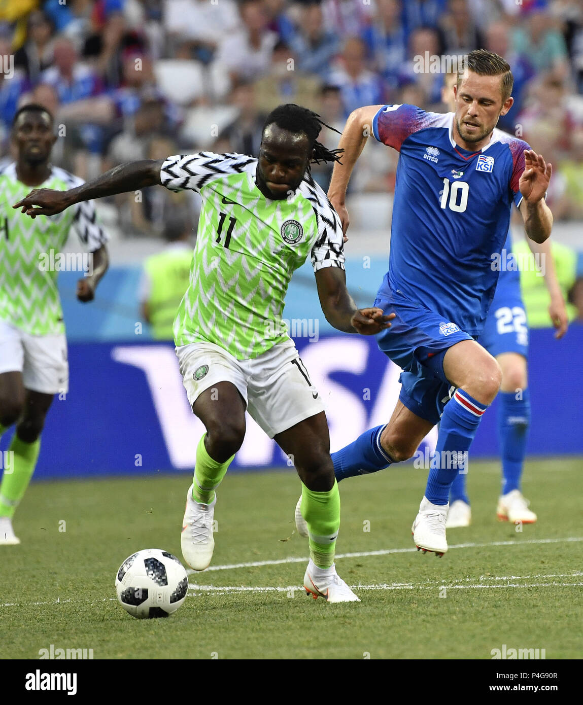 Volgograd, Russia. 22nd June, 2018. Victor Moses (C) of Nigeria vies with Gylfi Sigurdsson (R) of Iceland during the 2018 FIFA World Cup Group D match between Nigeria and Iceland in Volgograd, Russia, June 22, 2018. Credit: He Canling/Xinhua/Alamy Live News Stock Photo