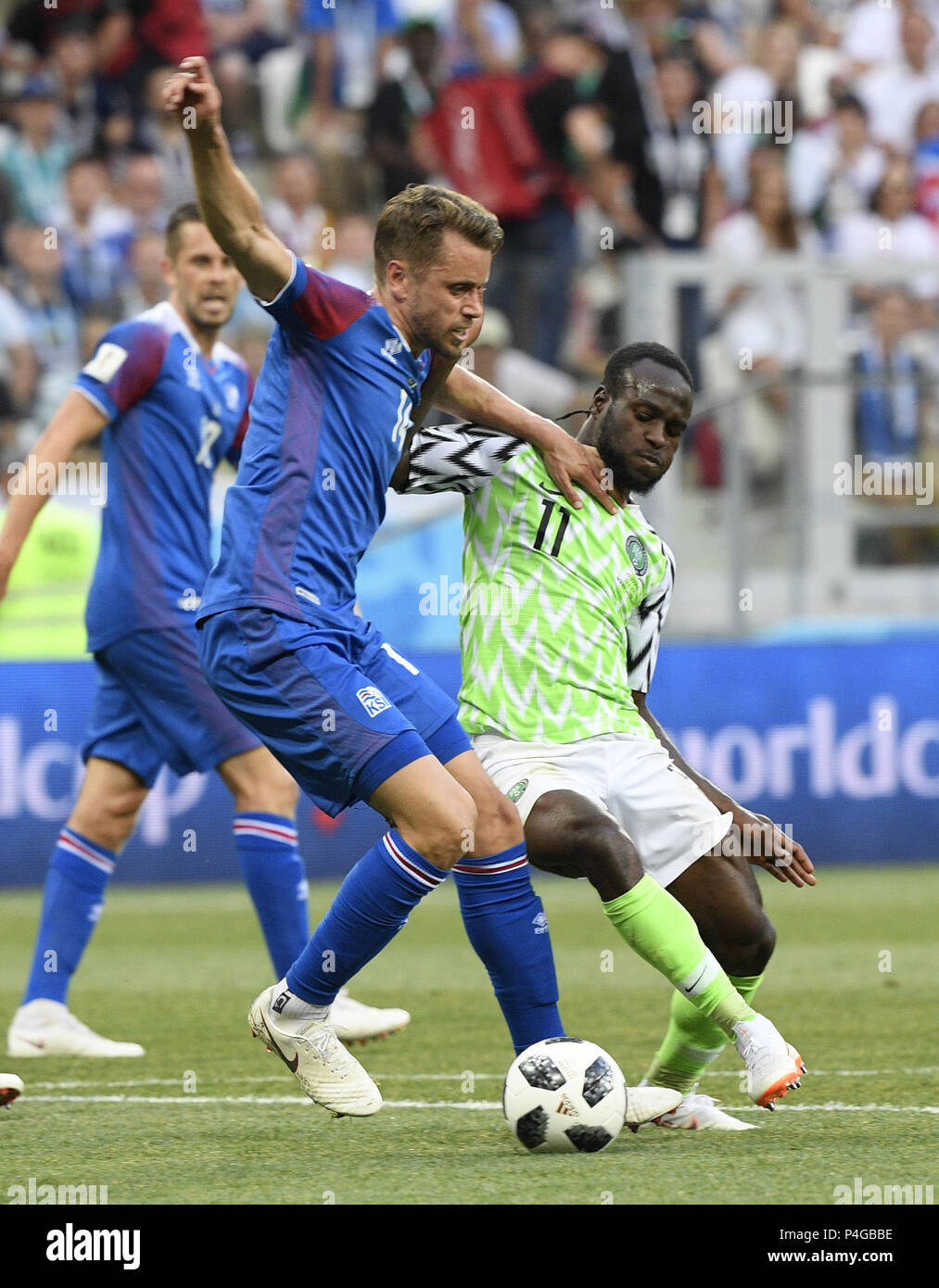 Volgograd, Russia. 22nd June, 2018. Kari Arnason (L) of Iceland vies with Victor Moses of Nigeria during the 2018 FIFA World Cup Group D match between Nigeria and Iceland in Volgograd, Russia, June 22, 2018. Nigeria won 2-0. Credit: Lui Siu Wai/Xinhua/Alamy Live News Stock Photo