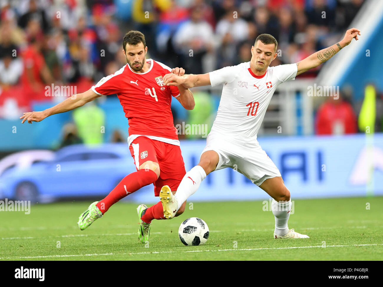 Kaliningrad, Russia. 22nd June, 2018. Granit Xhaka (R) of Switzerland vies with Luka Milivojevic of Serbia during the 2018 FIFA World Cup Group E match between Switzerland and Serbia in Kaliningrad, Russia, June 22, 2018. Credit: Liu Dawei/Xinhua/Alamy Live News Stock Photo