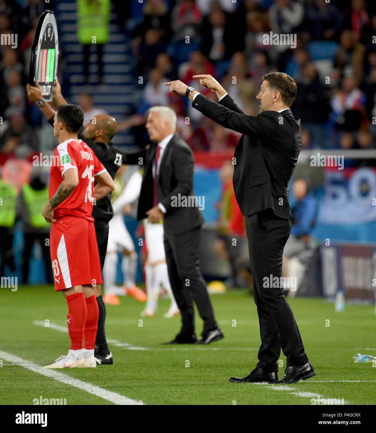 Kaliningrad, Russia. 22nd June, 2018. Serbia's head coach Mladen Krstajic (R) gives instructions to players during the 2018 FIFA World Cup Group E match between Switzerland and Serbia in Kaliningrad, Russia, June 22, 2018. Credit: Chen Cheng/Xinhua/Alamy Live News Stock Photo