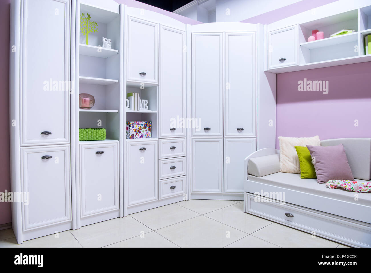 cozy modern living room interior with closet and couch Stock Photo - Alamy