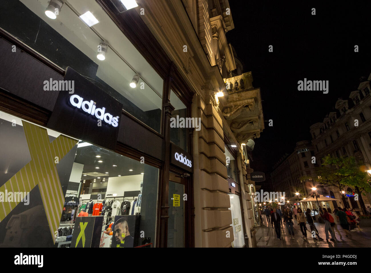 BELGRADE, SERBIA - JUNE 16, 2018: Logo of Adidas on their main store for Belgrade. Adidas is a German sportswear brand, the biggest in Europe  Picture Stock Photo