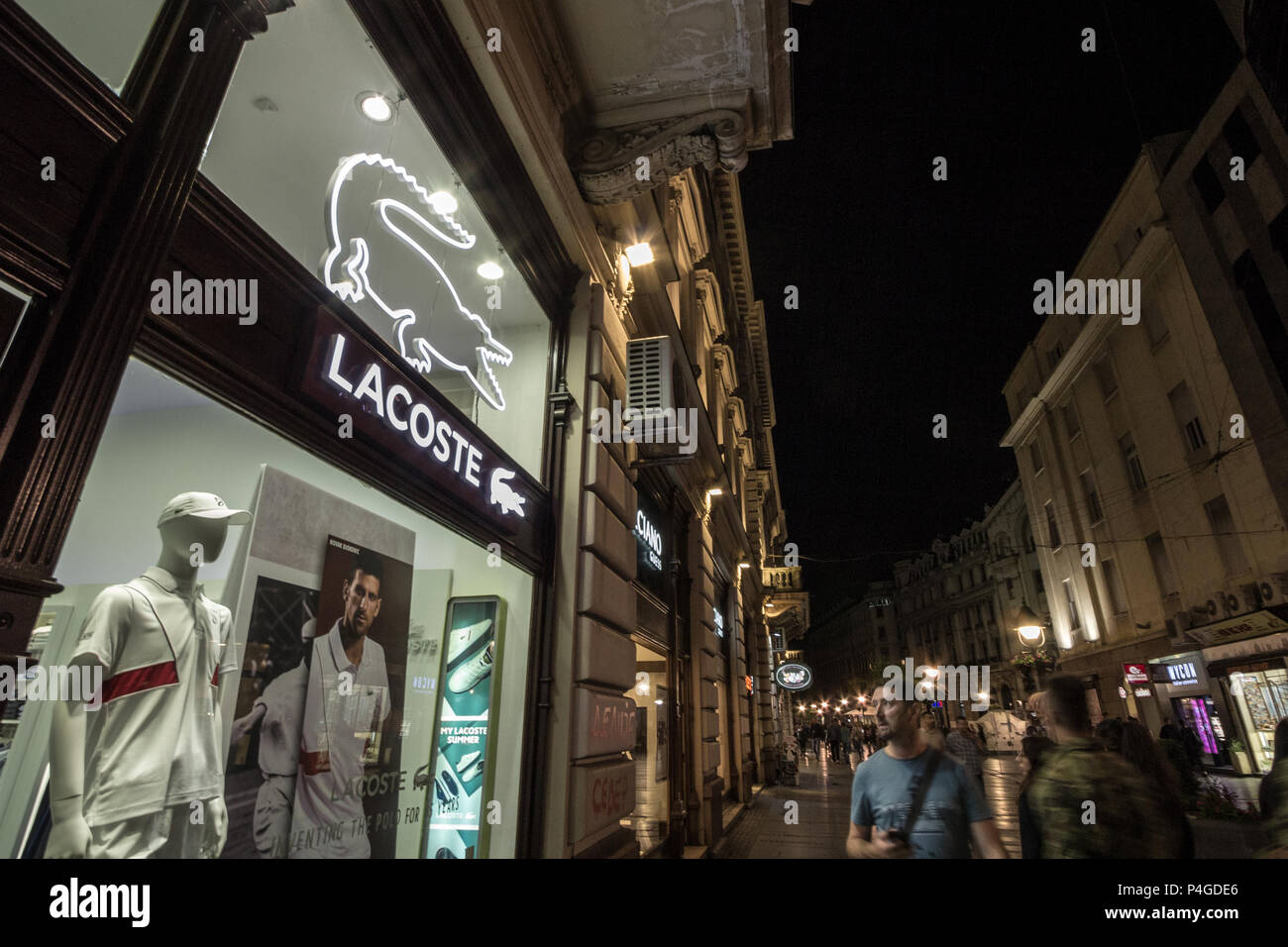 BELGRADE, SERBIA - JUNE 16, 2018: Logo of Lacoste on their main store for Belgrade. Lacoste is a French clothing company, selling clothing, footwear,  Stock Photo