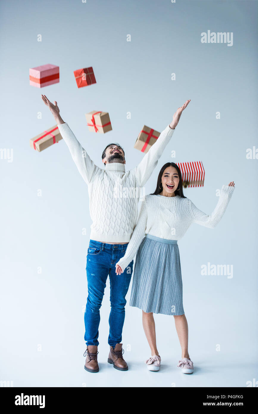 Woman catching christmas gift boxes hi-res stock photography and images ...