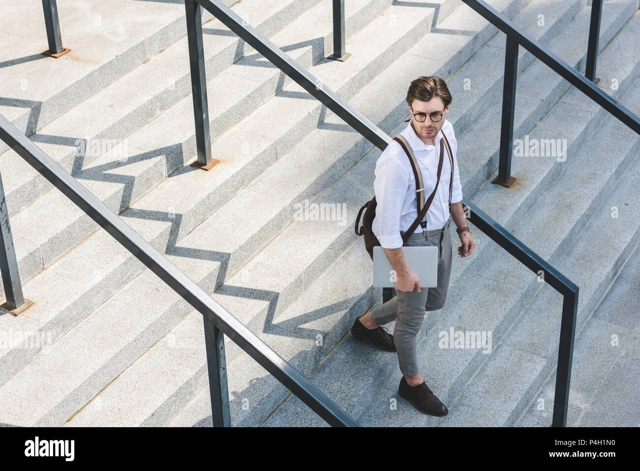 Man walking on stairs hi-res stock photography and images - Alamy