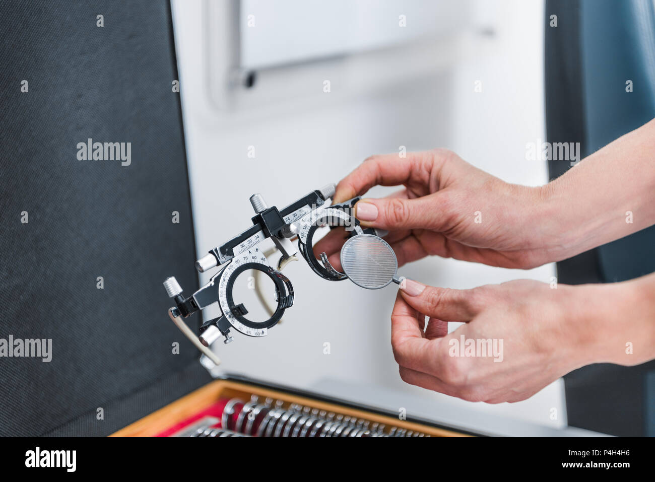 cropped view of oculist hands holding trial frame Stock Photo