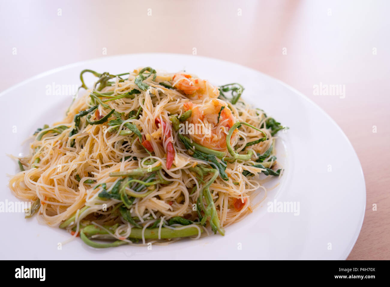 Thin rice noodles stir fried with shrimp and water minosa or Mee Phat