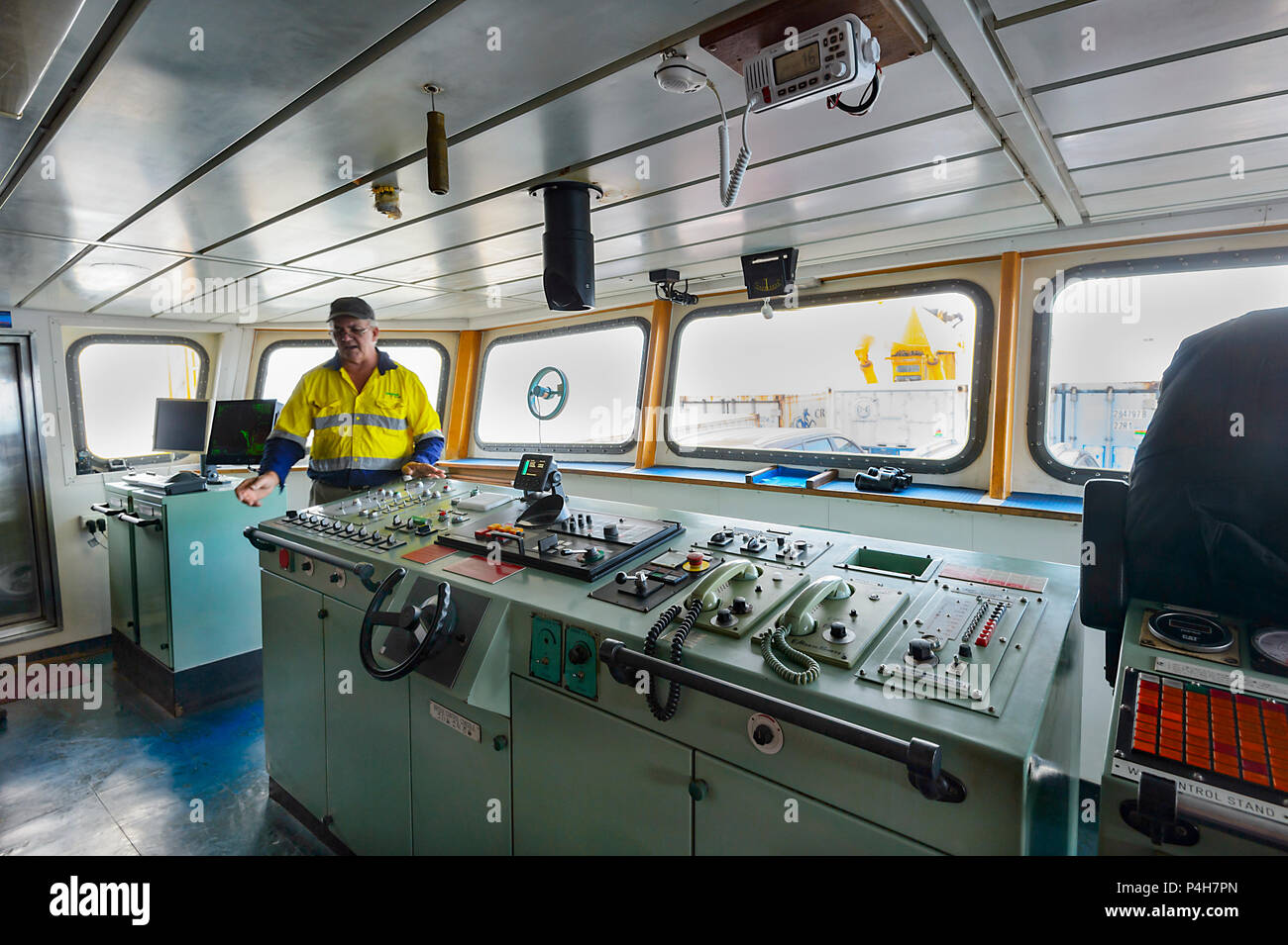 Captain standing on the bridge of M.V. Trinity Bay, a SeaSwift vessel