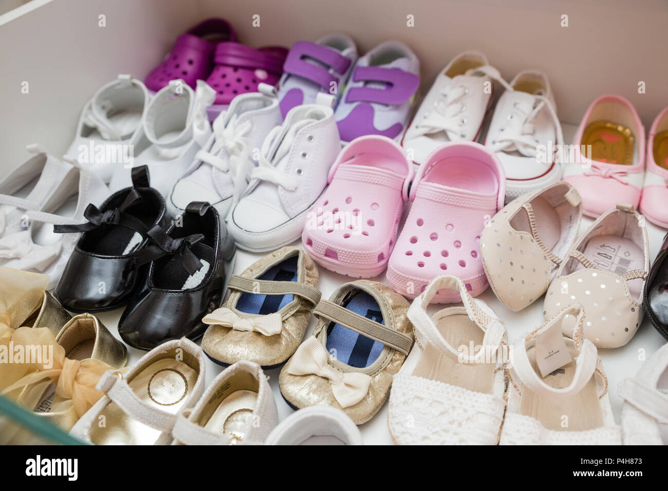 colorful brand new baby girl shoes inside closet with bright lighting Stock  Photo - Alamy