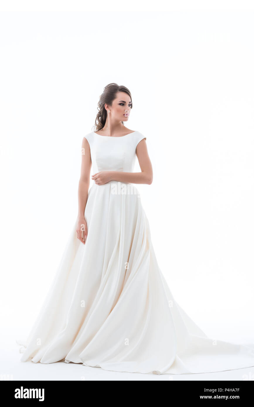attractive elegant bride posing in traditional wedding dress, isolated ...