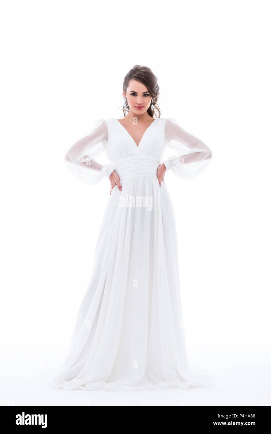 attractive bride posing in traditional wedding dress, isolated on white ...