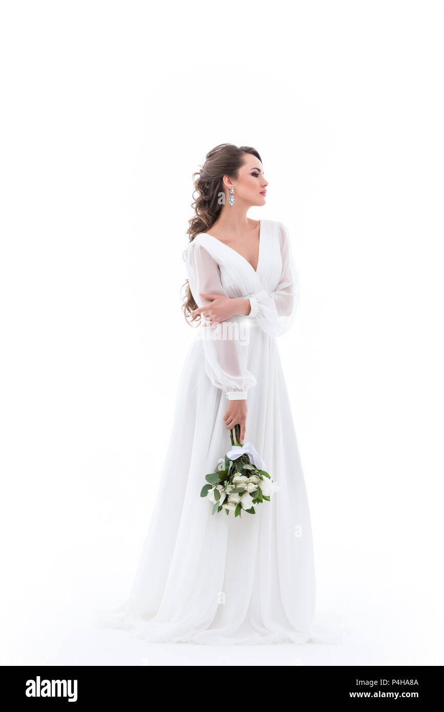elegant bride posing in white dress with wedding bouquet, isolated on ...