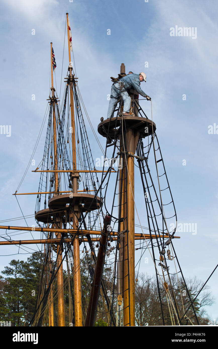 Rigging disassembly proceeds on historic sailing ship, a 17th century recreation, at Jamestown Settlement Pier, historic Jamestown, different moment. Stock Photo