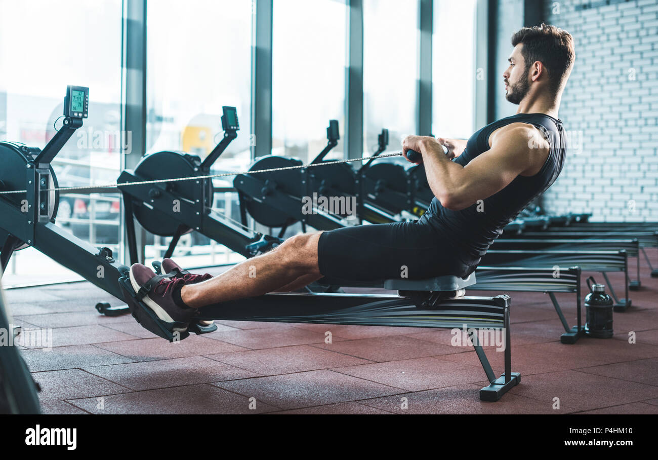 Exercise on rowing machine hi-res stock photography and images - Alamy