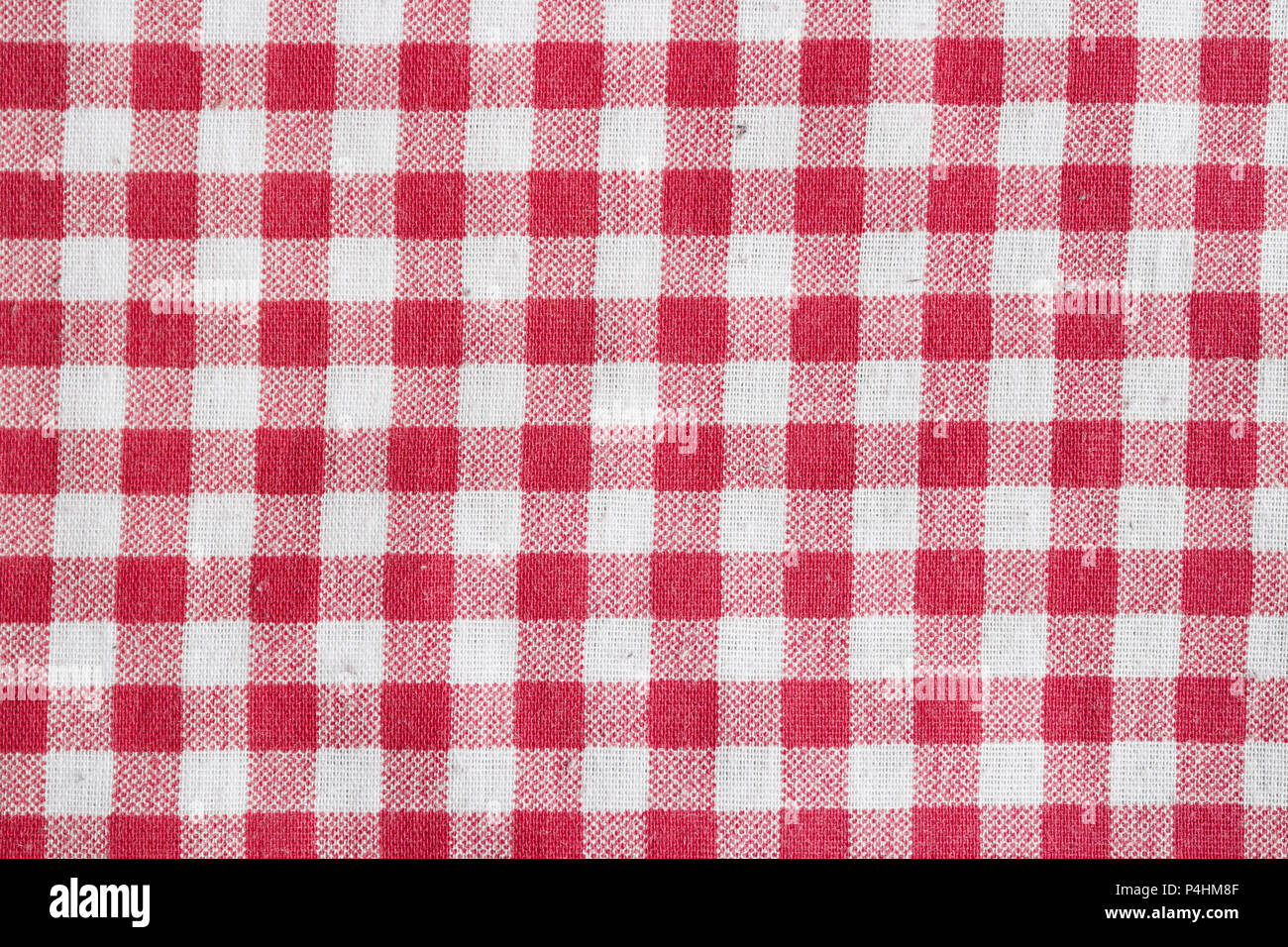 Red and white checkered fabric texture. Red picnic tablecloth background. Stock Photo