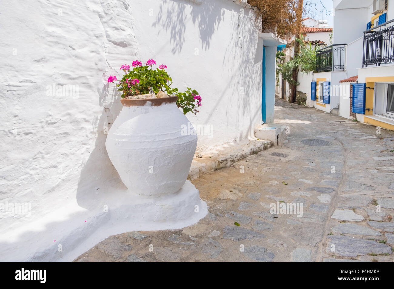 Beautiful traditional street in a quiet greek town. Stock Photo