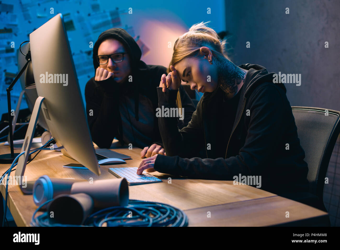 depressed couple of hackers having problem with malware development Stock Photo