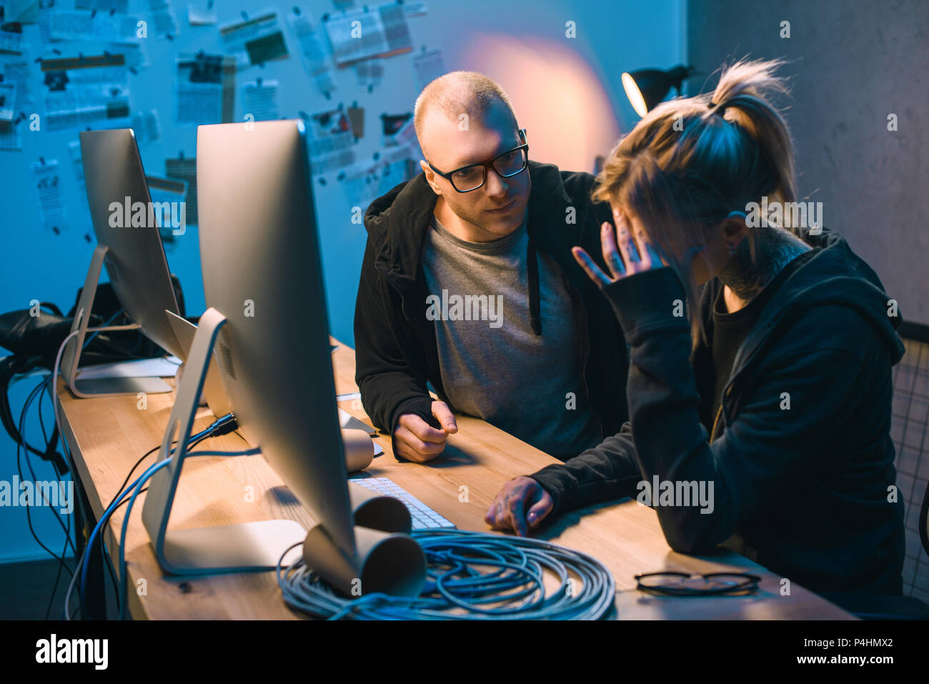 depressed couple of hackers have problem with malware development Stock Photo