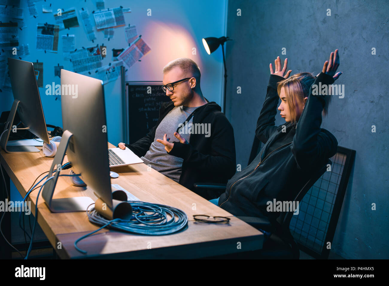 couple of hackers have problem with malware development Stock Photo