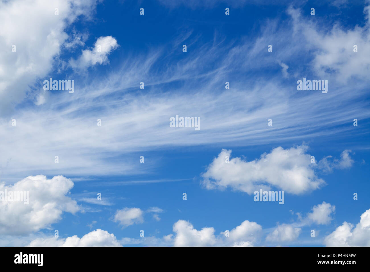 Blue sky and clouds over horizon. White heap clouds in the blue sky. Stock Photo