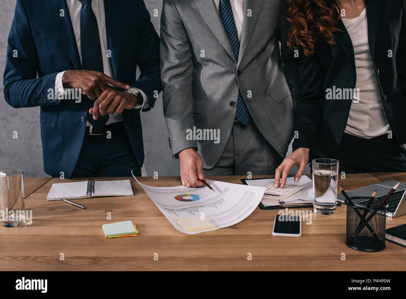 Cropped image of three business colleagues doing paperwork Stock Photo