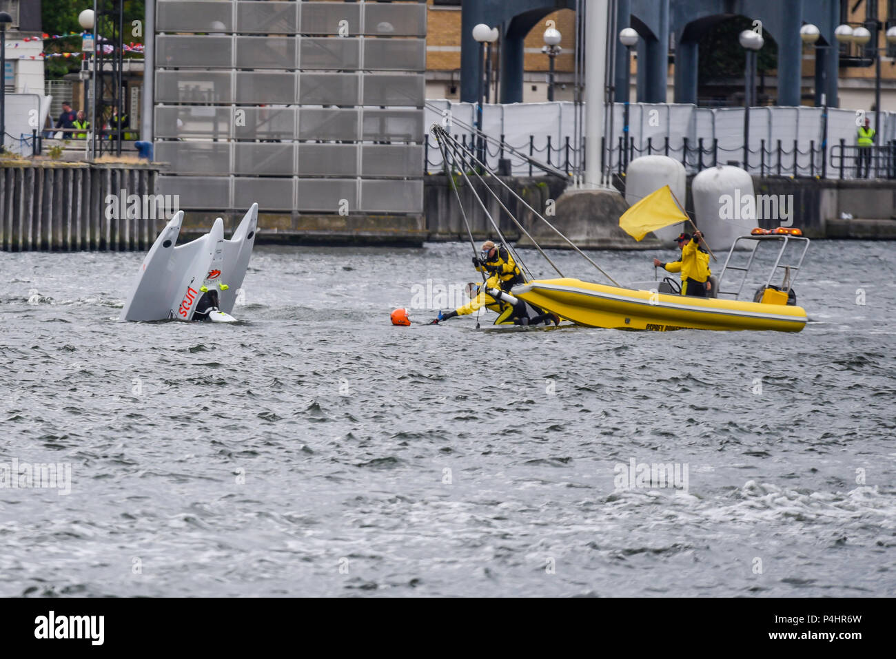 Louise Vella crashed in the F1H2O F4-S Powerboat Grand Prix of London at Royal Victoria Dock, Docklands, UK. Osprey rescue boat pulling her out Stock Photo