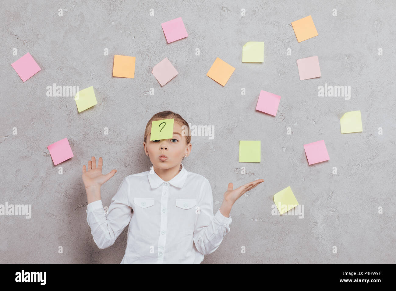 portrait of little girl with sticky note on face isolated on grey Stock ...