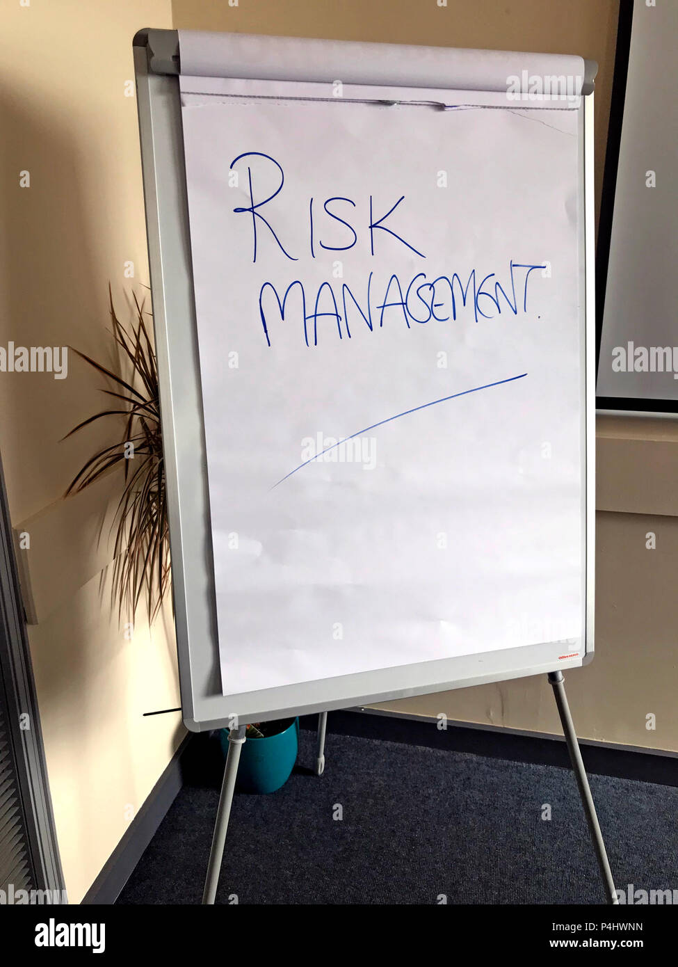 White Office Flipchart with Risk Management written on it Stock Photo
