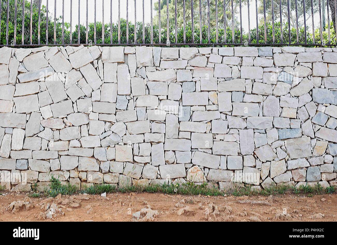 Dry stone wall texture background with railings on top Stock Photo - Alamy