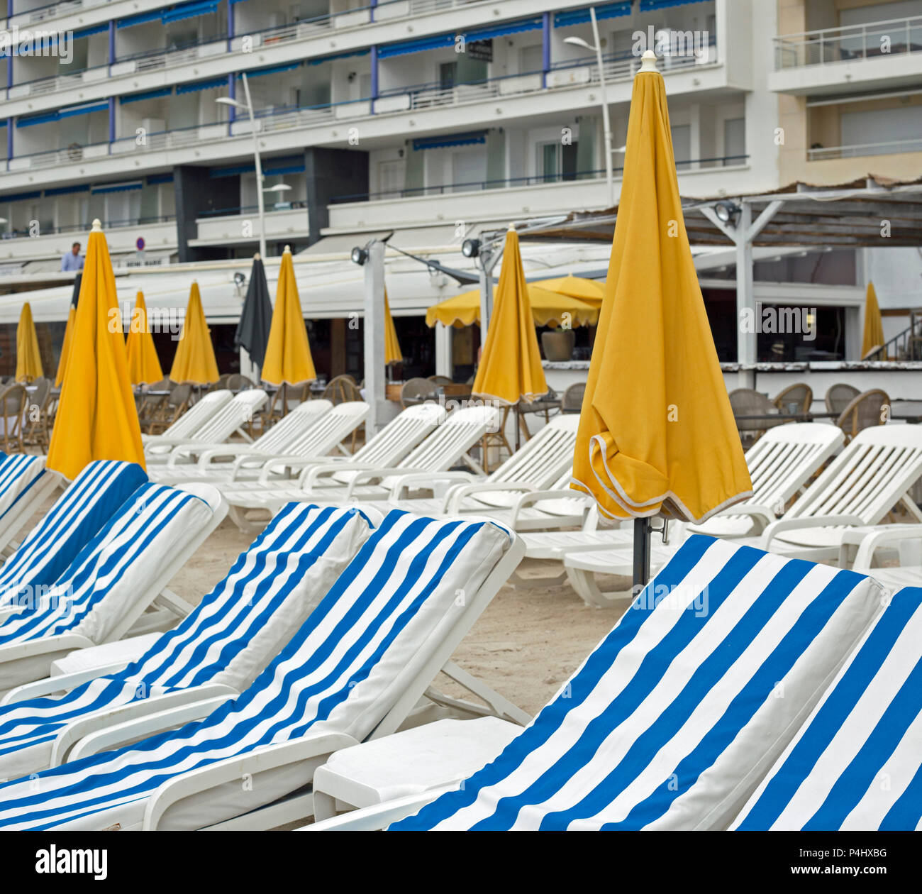 Juan Le Pins, Antibes, France, June 2018, Rows of blue and white  sun loungers on the beach. Stock Photo