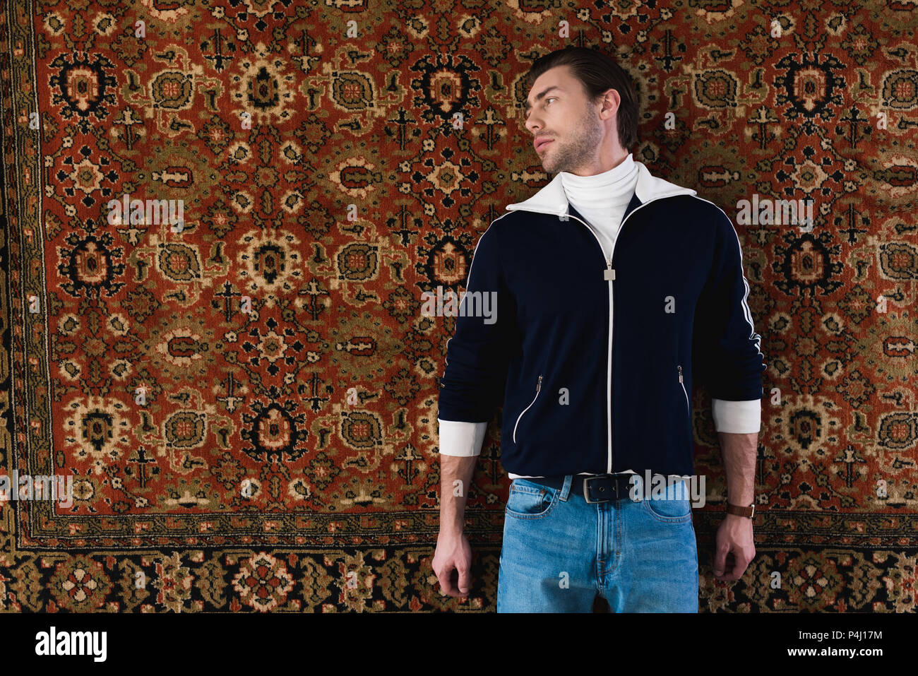 handsome young man in vintage clothes lying rug Stock Photo - Alamy