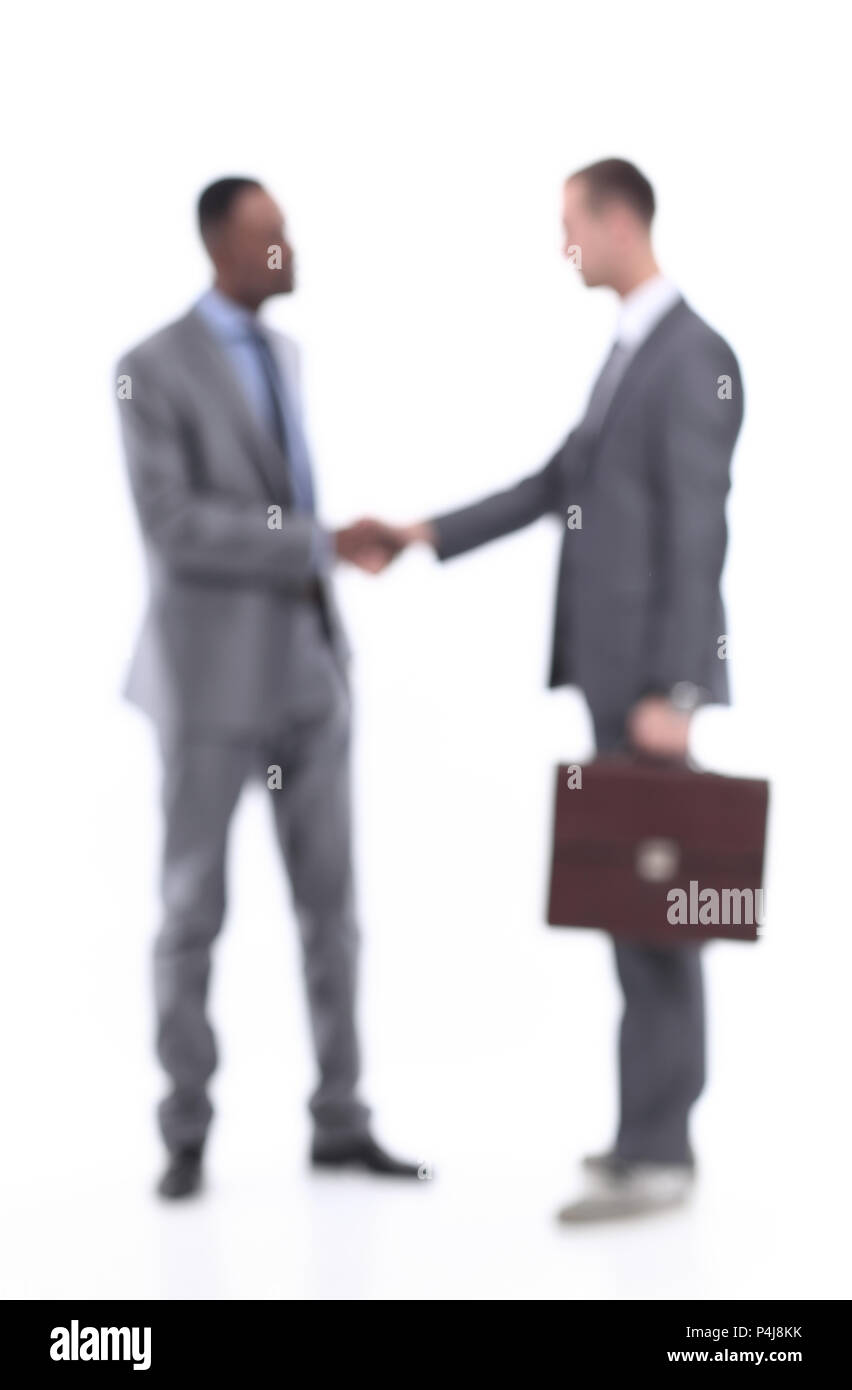 Blurred business people. Handshake of two business men. Stock Photo