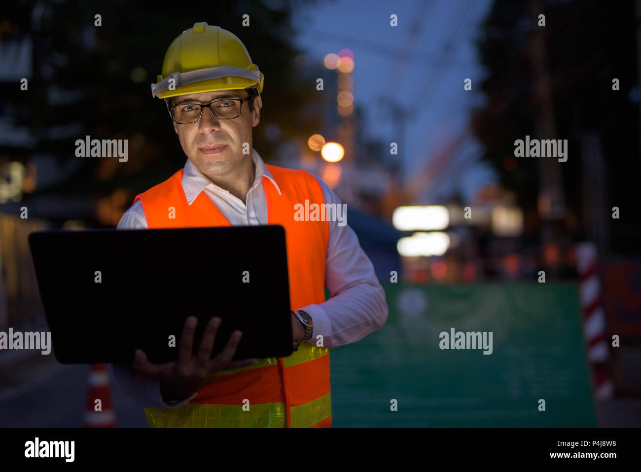 Handsome Persian man construction worker at the construction sit Stock Photo