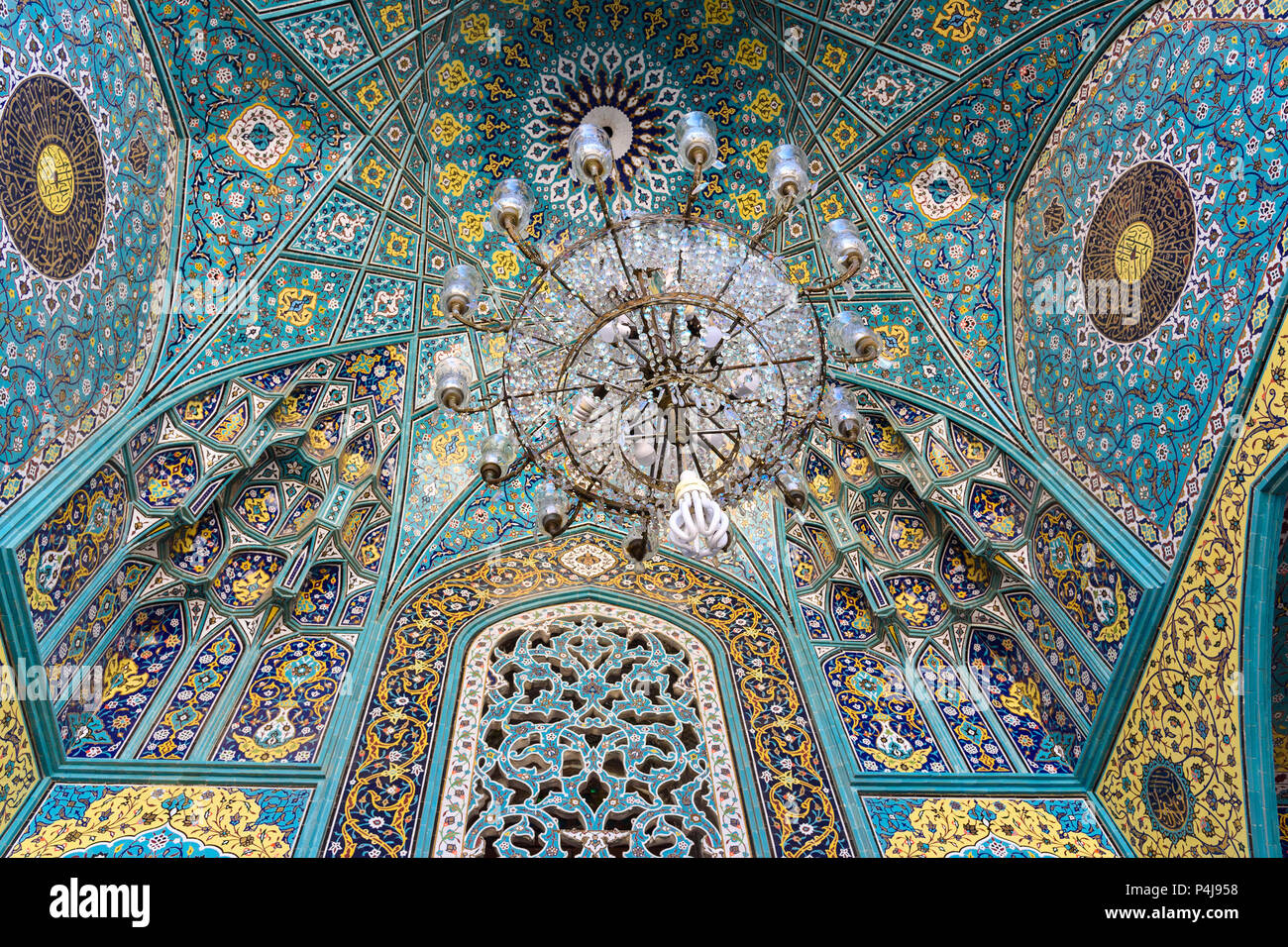 Shiraz, Iran - March 25, 2018: Tiles decoration on ceiling of Mirrored mausoleum of Sayyed Alaeddin Hossein Stock Photo