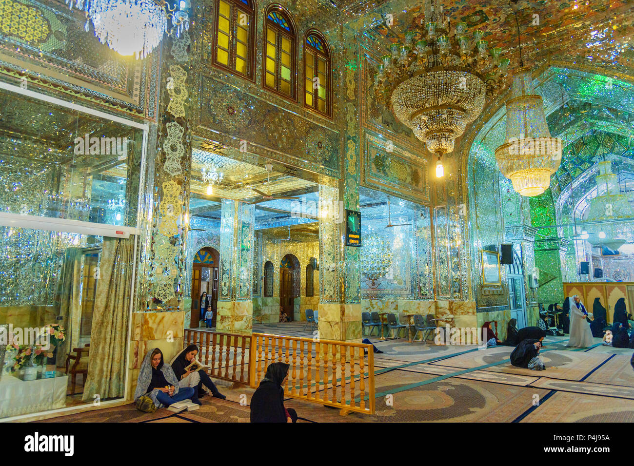 Shiraz, Iran - March 25, 2018: Interior of mirrored mausoleum of Sayyed Alaeddin Hossein Stock Photo
