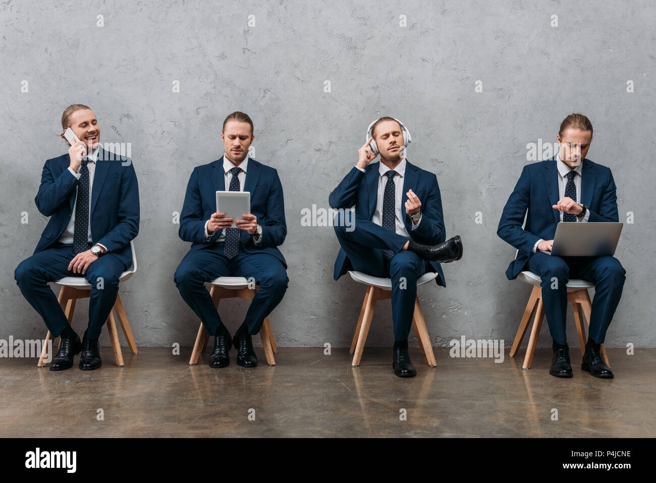 collage of cloned businessman sitting on chairs and using gadgets Stock Photo