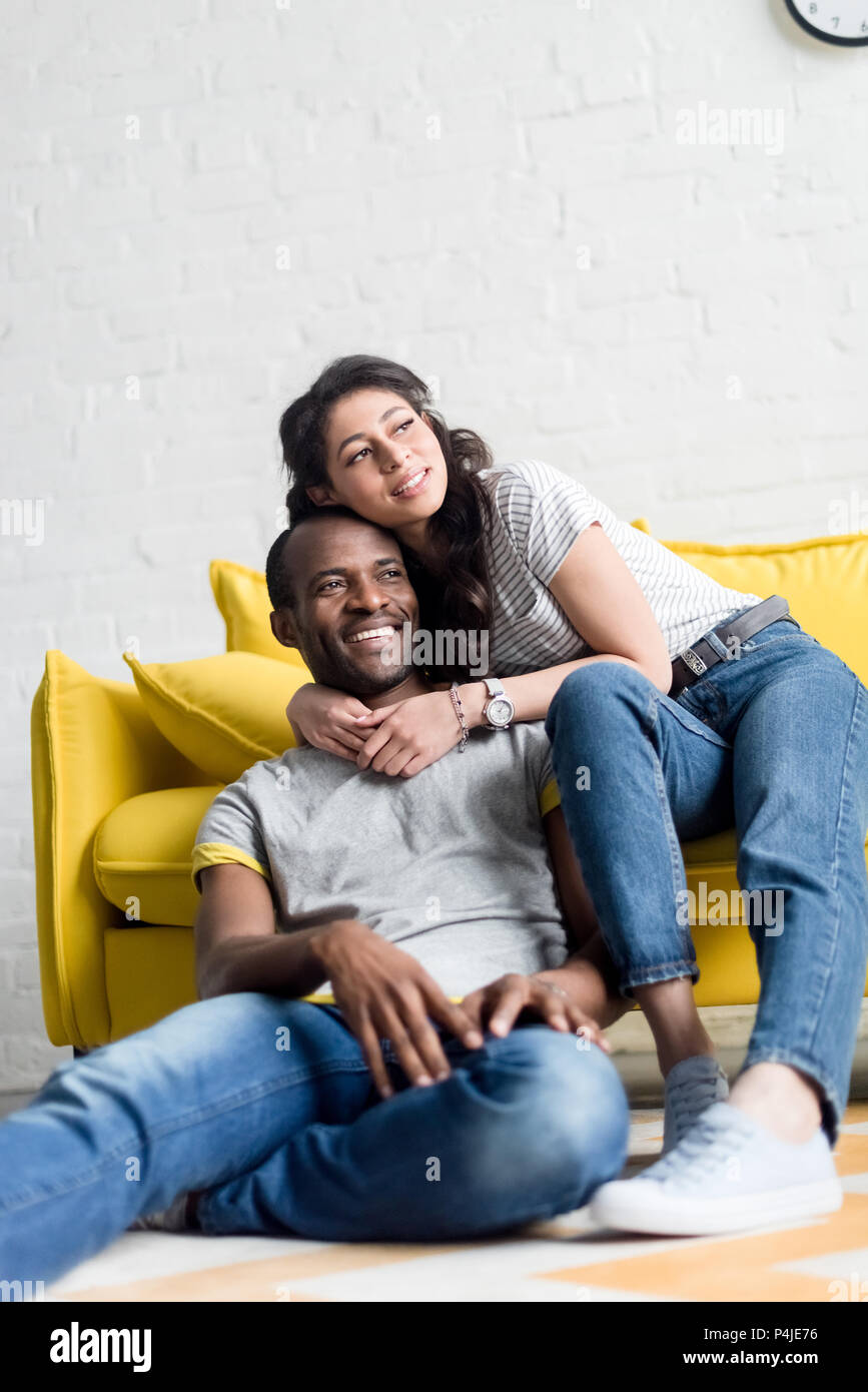 happy african american couple spending time together at living room ...