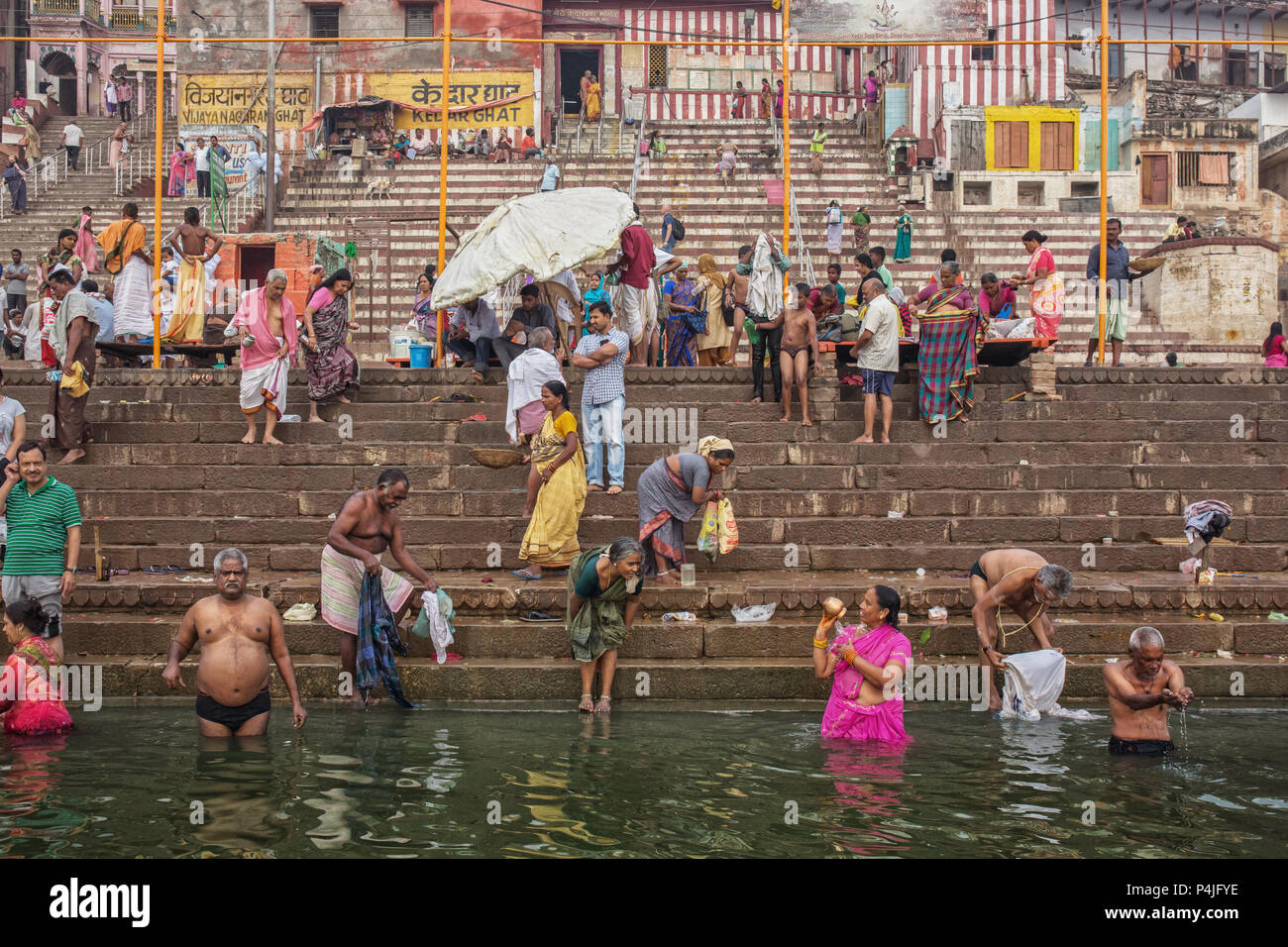 Men And Women Bathe In The Ganges River During Hindu Puja Varanasi India Puja Is Sacred Ritual For Indians And Means Hindu Praying Stock Photo Alamy