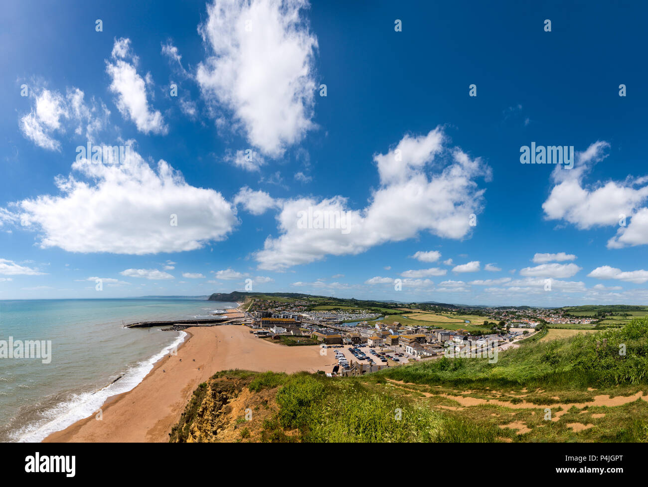 BRIDPORT, DORSET, UK - 6JUN2018: West Bay from cliffs to the East. Inland, the town of Bridport can also be seen. Stock Photo