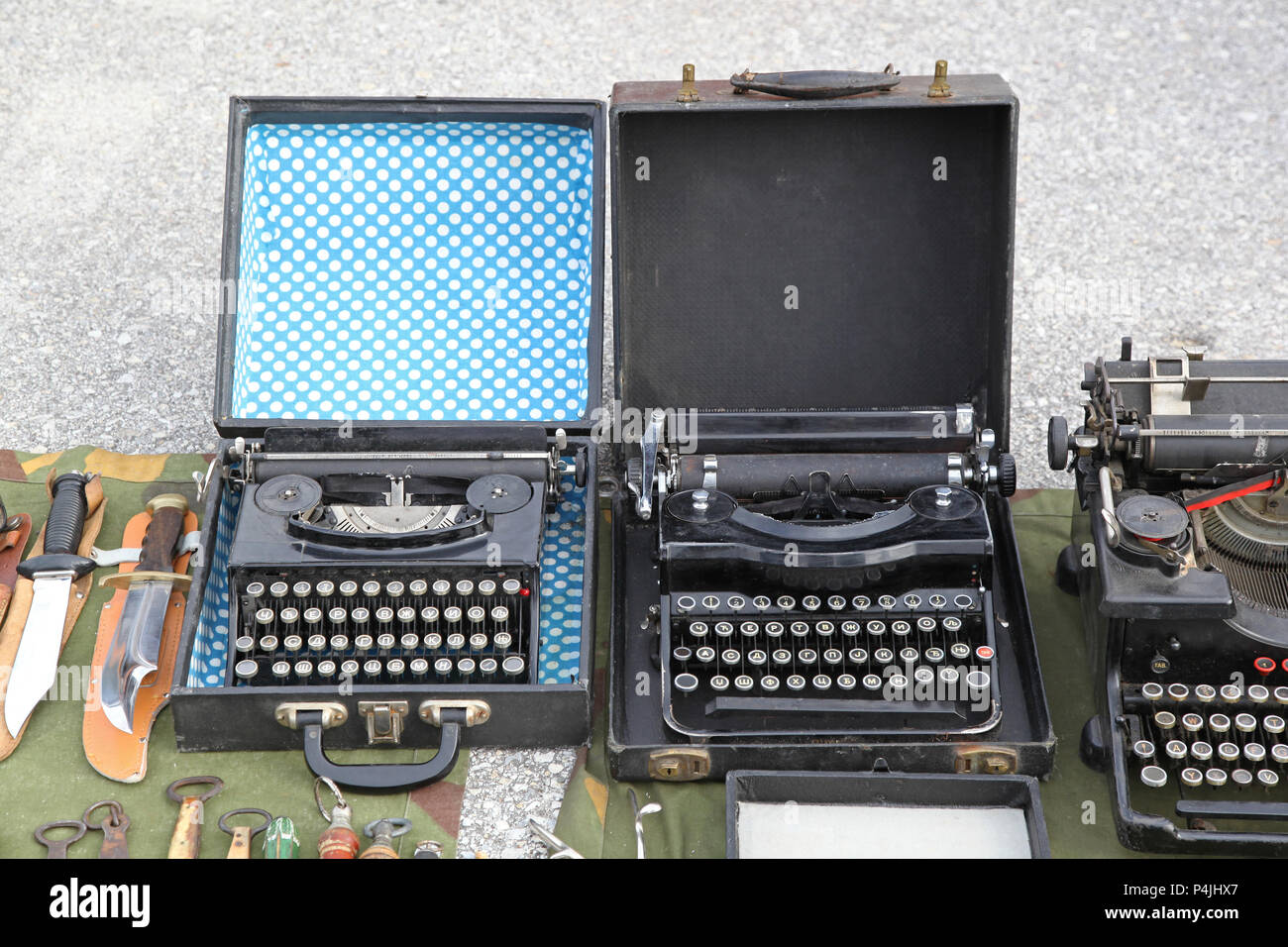 Vintage Portable Typewriters for Sale at Flea Market Stock Photo