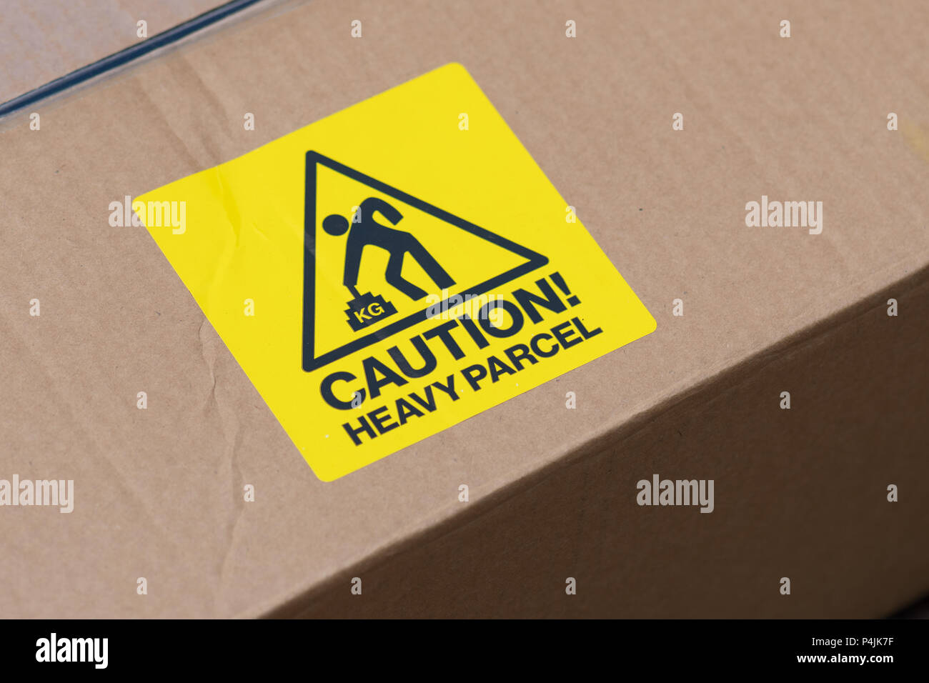 heavy parcel caution label Stock Photo