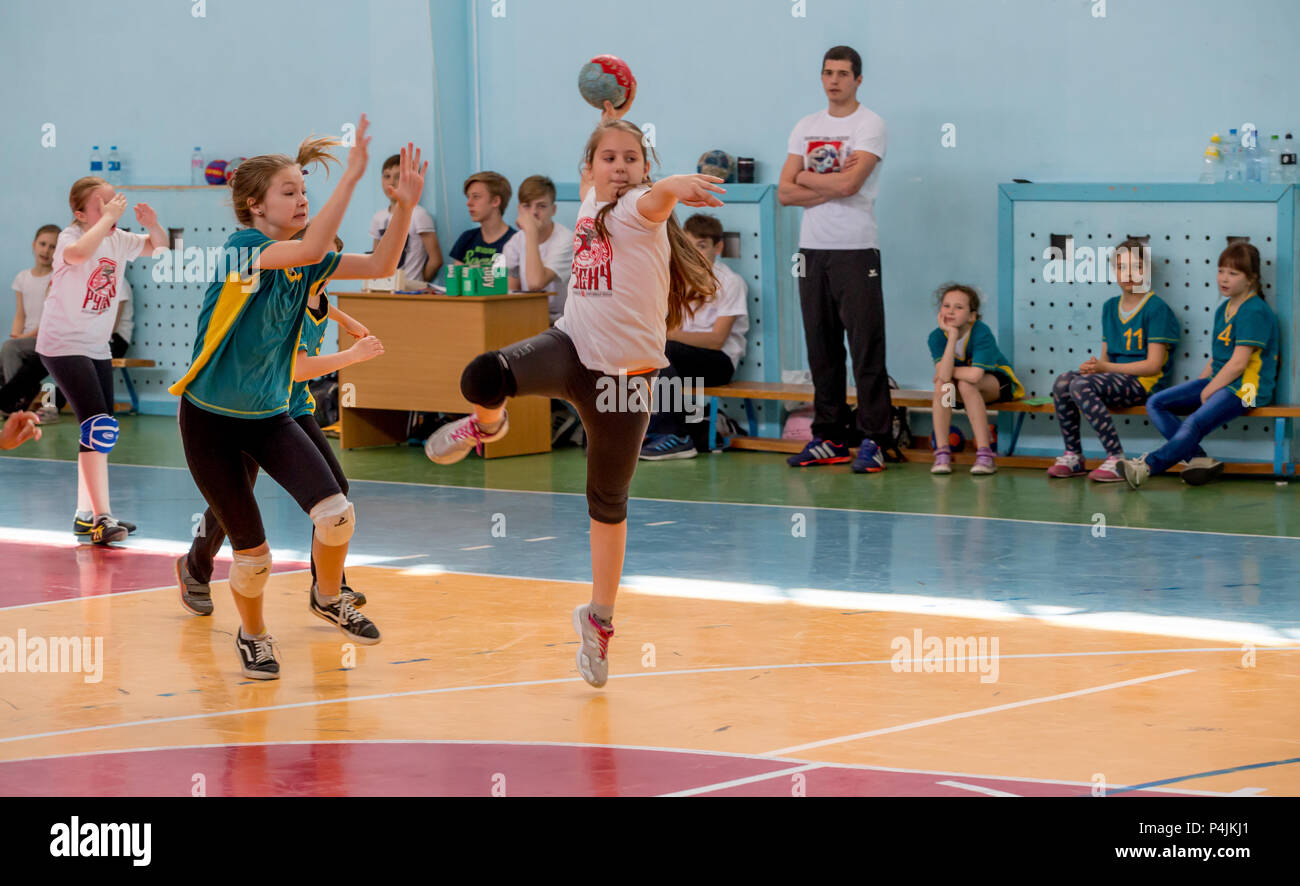 Russia, Vladivostok, 04/28/2018. Kids play handball indoor. Sports and