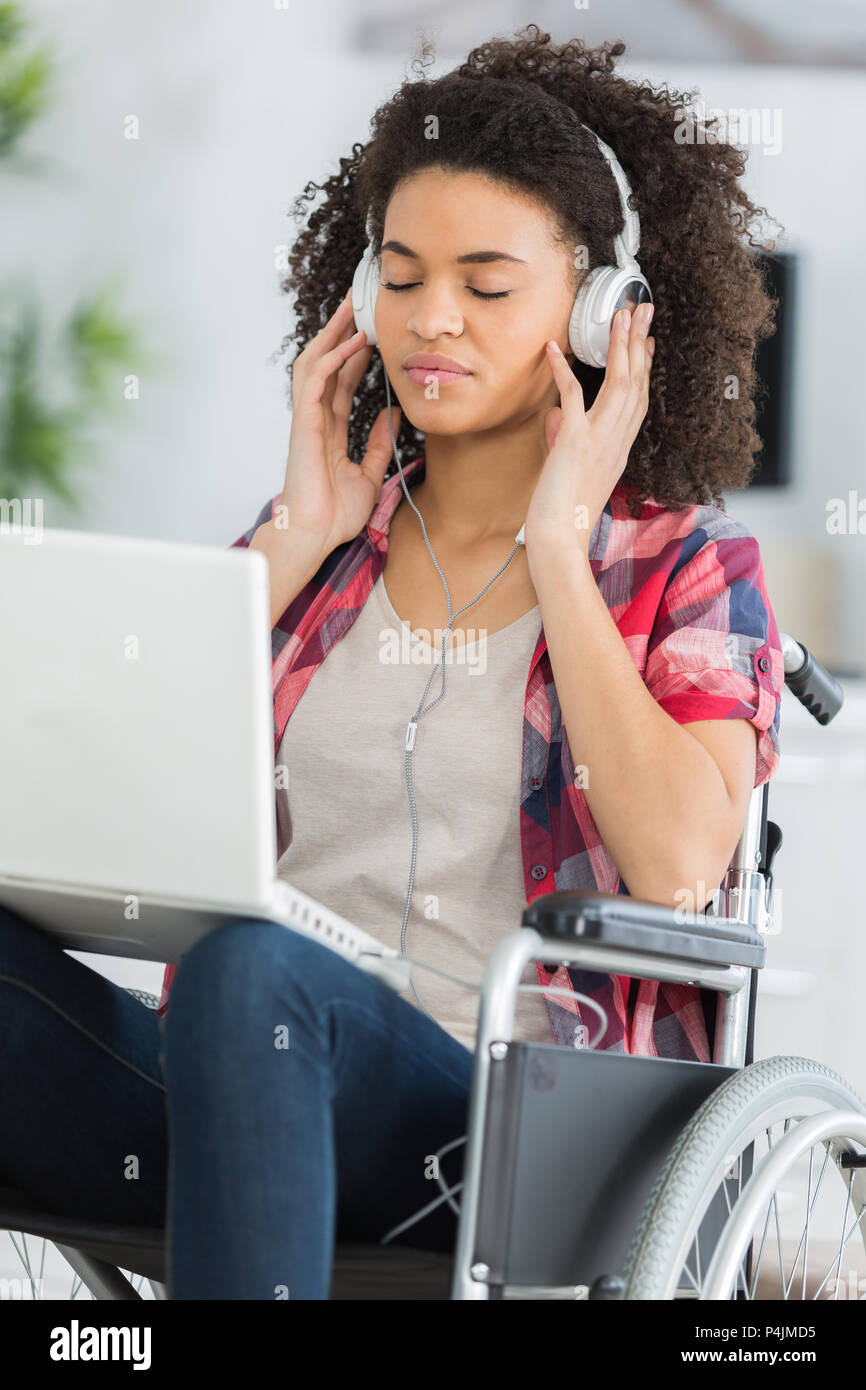 beautiful handicaped woman listening to music and relaxing Stock Photo