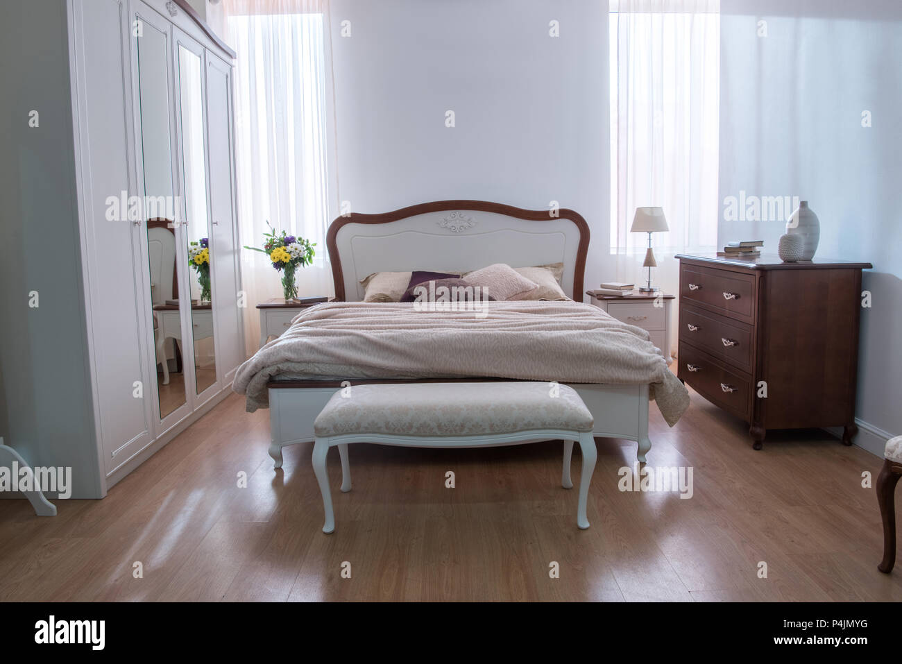 Interior of cozy bedroom with closet and bed in modern design Stock ...