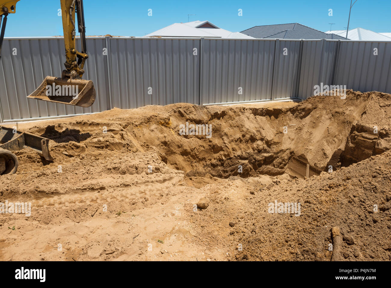 Excavation works for the installation of a swimming pool.Swimming pool under construction. Stock Photo
