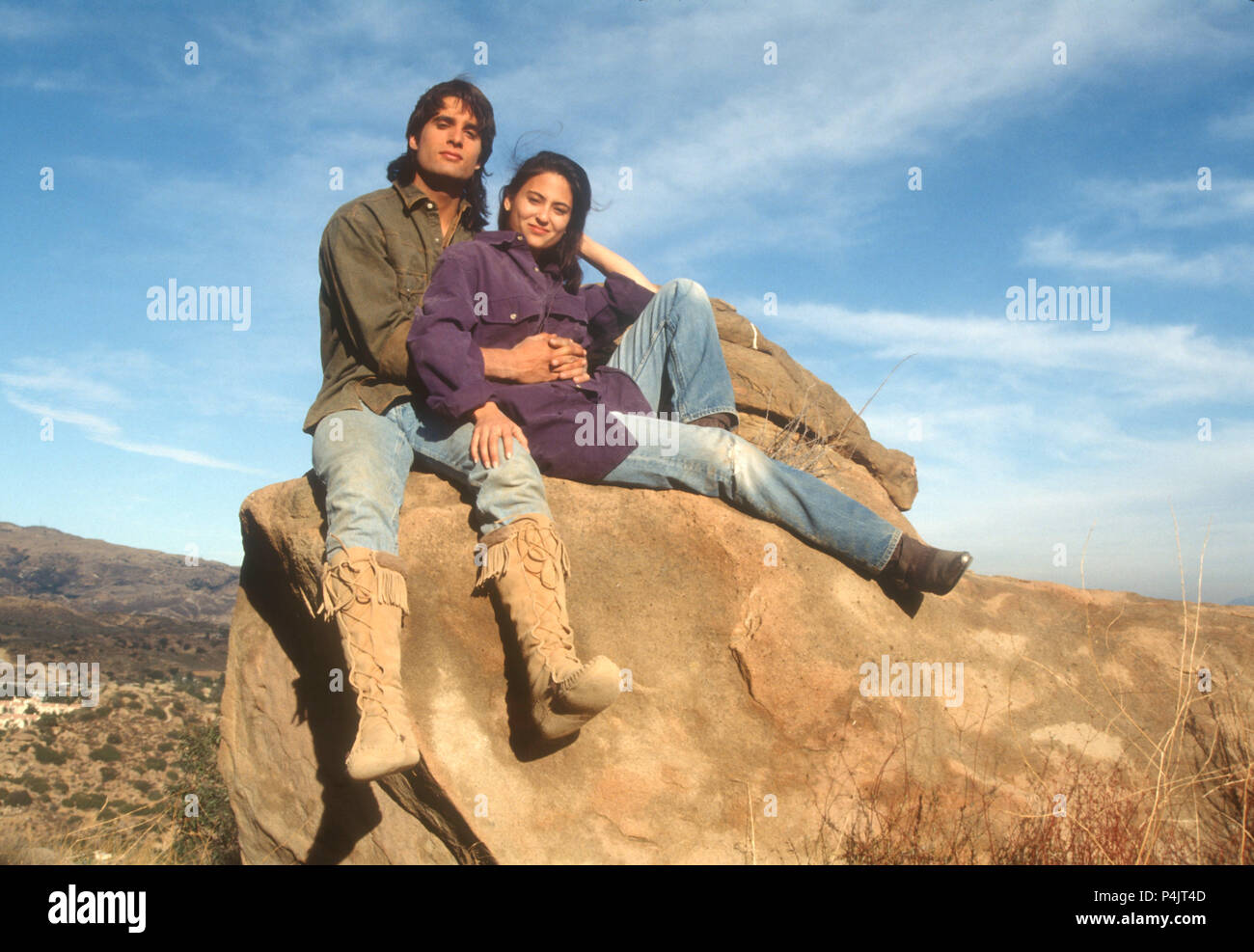 AGUA DULCE, CA - NOVEMBER 21: (EXCLUSIVE COVERAGE) Actor John Haymes Newton, aka John Newton and actress Judie Aronson on location filming 'Desert Kickboxer' on November 21, 1991 at Vasquez Rocks in Agua Dulce, California. Photo by Barry King/Alamy Stock Photo Stock Photo