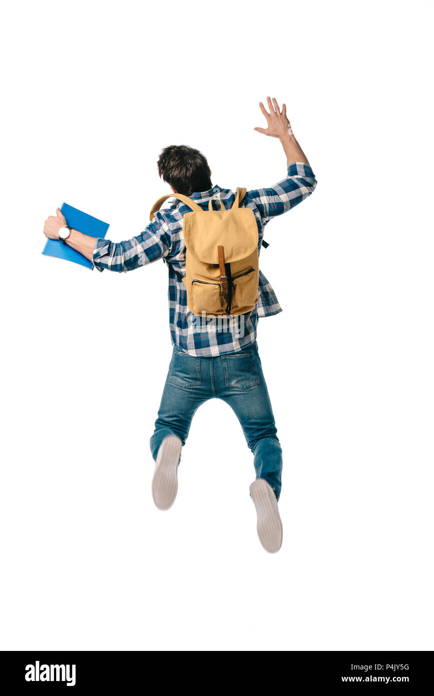 back view of student jumping with backpack and copybook isolated on ...