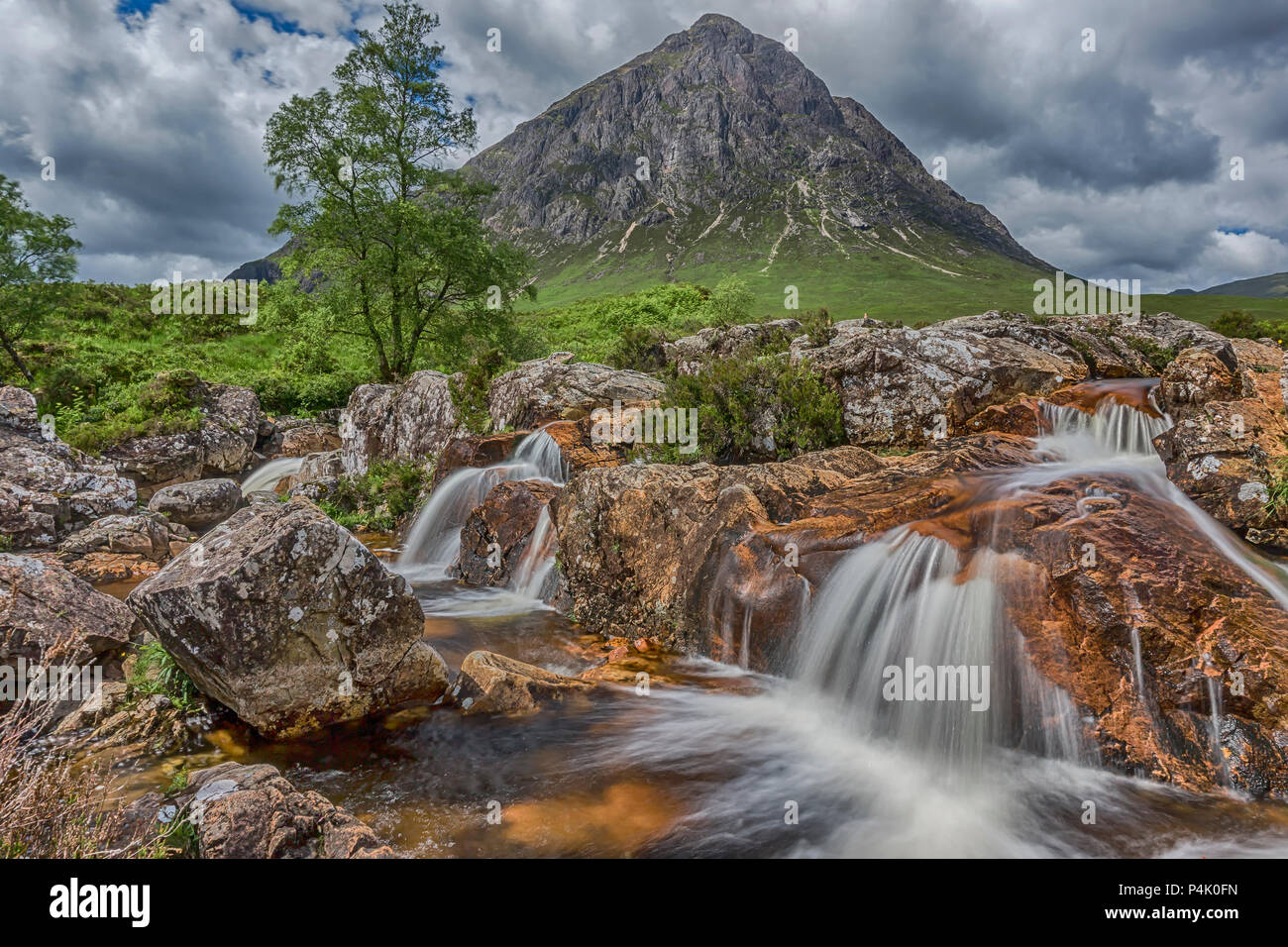 The waterfall on the River Coupall underneath Buachaille Etive Mòr Stock Photo